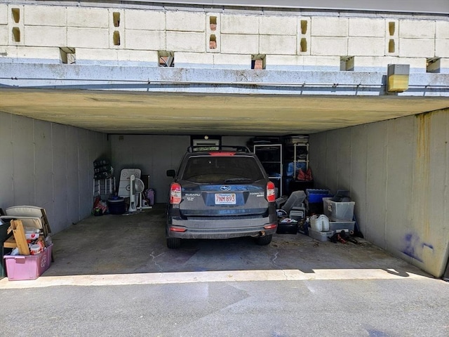 12 Sutton Ct Unit 12, Amherst, MA 01002 - view of vehicle parking with a carport