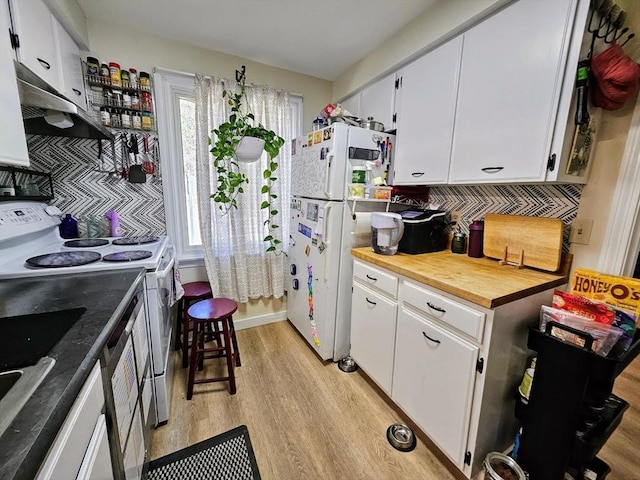 12 Sutton Ct Unit 12, Amherst, MA 01002 - kitchen with white appliances, light wood finished floors, under cabinet range hood, and white cabinets