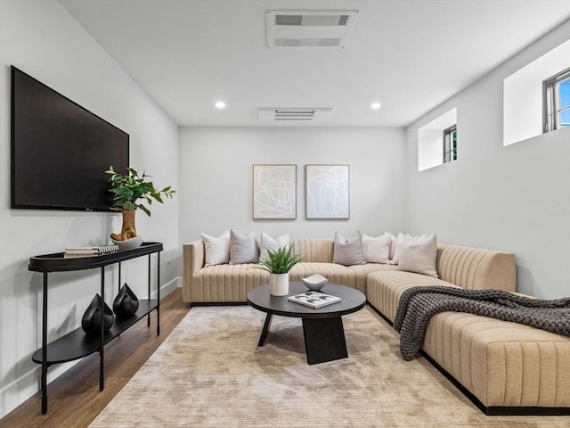 living room with light hardwood / wood-style flooring