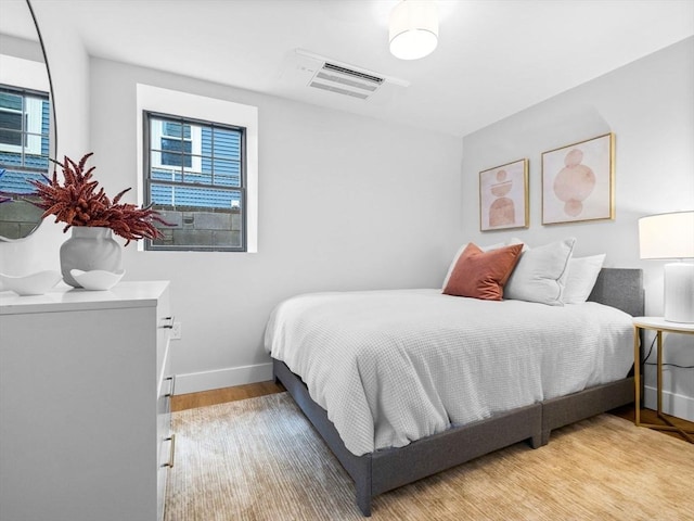 bedroom with light hardwood / wood-style flooring