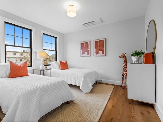 bedroom with hardwood / wood-style flooring