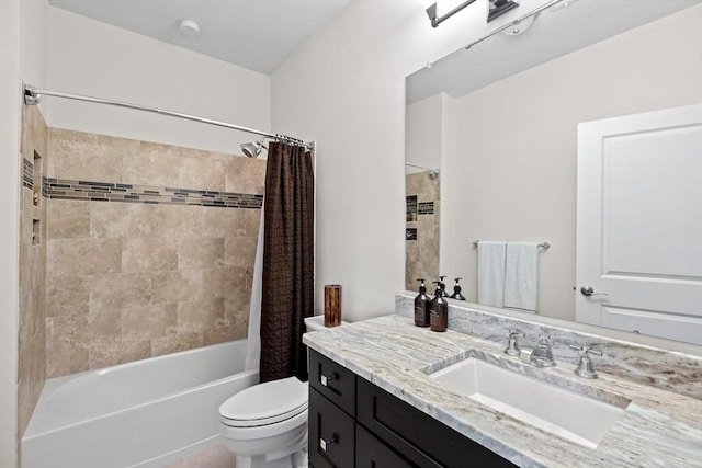 bathroom featuring toilet, shower / tub combo with curtain, and vanity