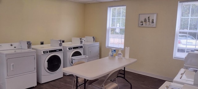 clothes washing area featuring washing machine and dryer and dark hardwood / wood-style floors