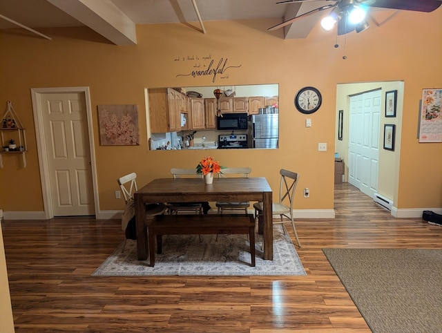 dining area with dark hardwood / wood-style floors, beam ceiling, and ceiling fan