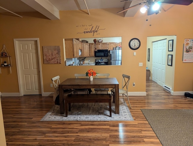 dining space with ceiling fan, beam ceiling, and dark hardwood / wood-style flooring