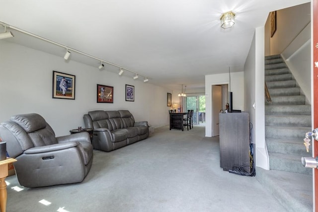 6 Loring Hills Ave Unit G4, Salem, MA 01970 - living area with carpet, rail lighting, and stairs