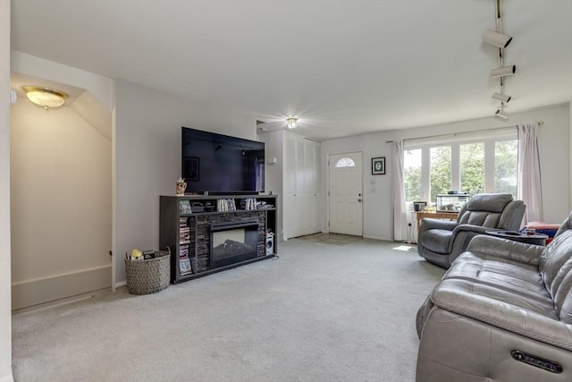 6 Loring Hills Ave Unit G4, Salem, MA 01970 - carpeted living room featuring a fireplace and baseboards