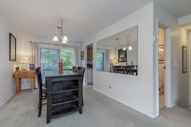 6 Loring Hills Ave Unit G4, Salem, MA 01970 - dining area featuring a chandelier, baseboards, and light carpet