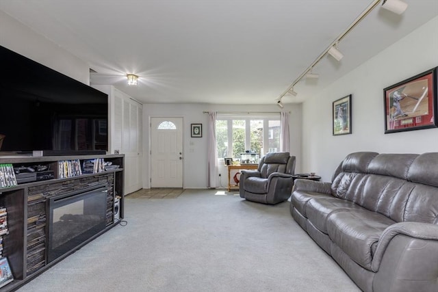 6 Loring Hills Ave Unit G4, Salem, MA 01970 - living room featuring rail lighting, carpet flooring, and a glass covered fireplace