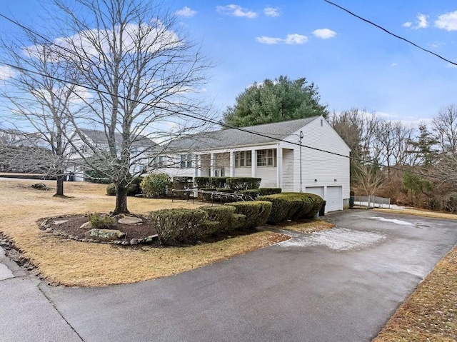 view of side of home with a garage