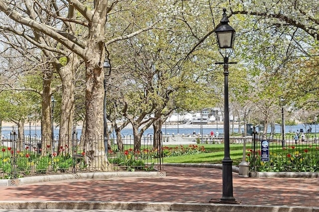 view of community with fence