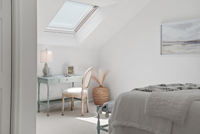 bedroom featuring carpet and vaulted ceiling with skylight