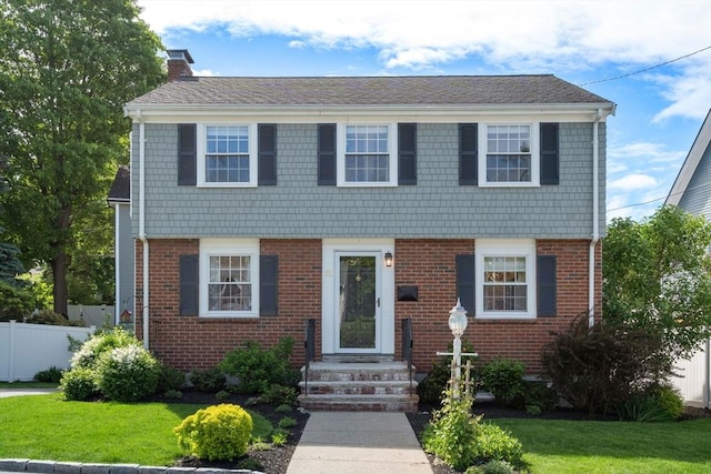 15 Janet Rd, Arlington, MA 02474 - colonial house with a chimney and brick siding