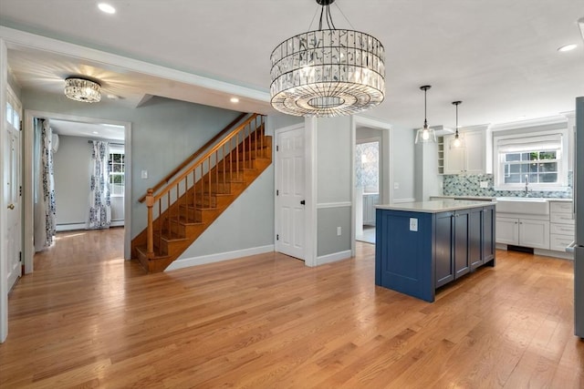 15 Janet Rd, Arlington, MA 02474 - kitchen featuring a chandelier, light wood-style floors, healthy amount of natural light, and recessed lighting