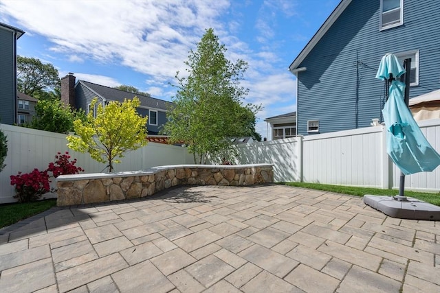 15 Janet Rd, Arlington, MA 02474 - fenced backyard with a patio area