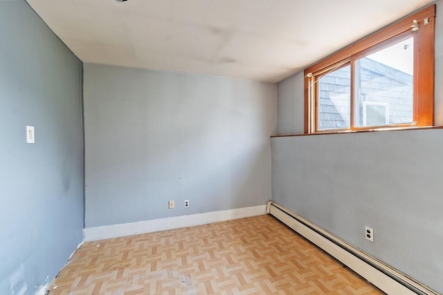 22 Taylor St Unit 1, Gloucester, MA 01930 - empty room featuring a baseboard heating unit and baseboards