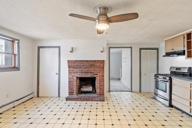 22 Taylor St Unit 1, Gloucester, MA 01930 - kitchen with stainless steel range with gas cooktop, under cabinet range hood, baseboard heating, a textured ceiling, and light floors