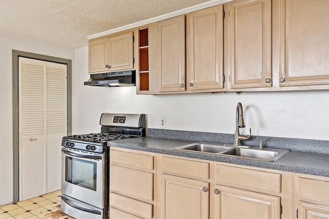 22 Taylor St Unit 1, Gloucester, MA 01930 - kitchen featuring under cabinet range hood, stainless steel range with gas stovetop, light brown cabinetry, dark countertops, and a textured ceiling