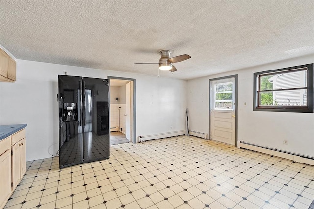 22 Taylor St Unit 1, Gloucester, MA 01930 - unfurnished room with baseboard heating, light floors, ceiling fan, and a textured ceiling