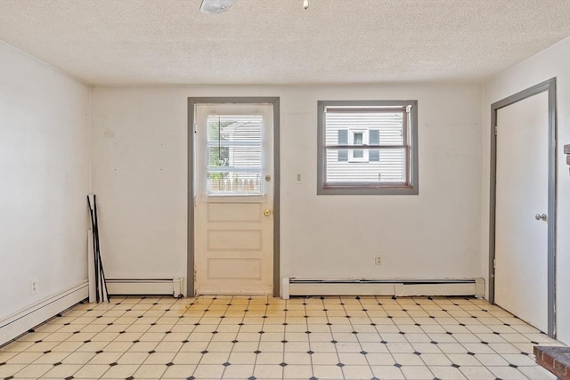 22 Taylor St Unit 1, Gloucester, MA 01930 - doorway featuring a baseboard radiator, light flooring, baseboard heating, and a textured ceiling