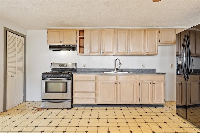 22 Taylor St Unit 1, Gloucester, MA 01930 - kitchen with stainless steel gas stove, under cabinet range hood, light brown cabinets, a textured ceiling, and black fridge with ice dispenser