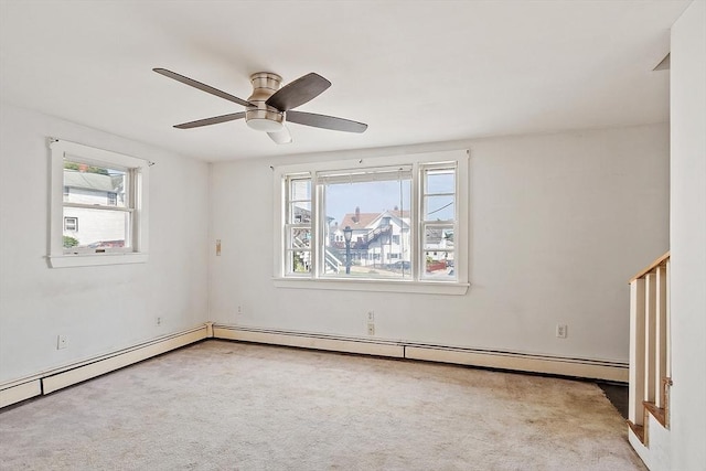 22 Taylor St Unit 1, Gloucester, MA 01930 - carpeted empty room featuring plenty of natural light, a baseboard heating unit, and a ceiling fan