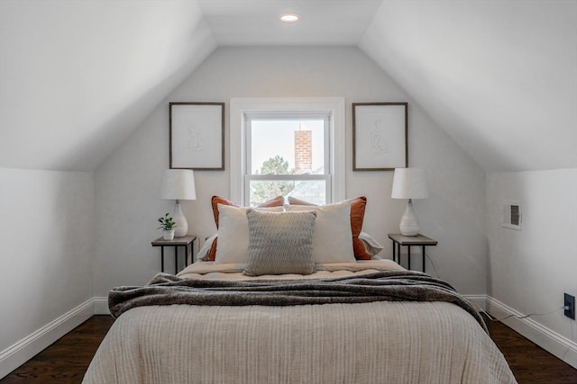 bedroom featuring lofted ceiling and dark wood-type flooring