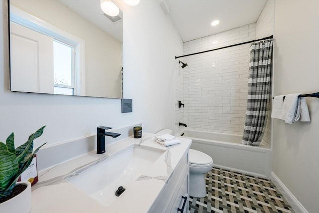 full bathroom with toilet, tile patterned floors, vanity, and shower / bath combo with shower curtain