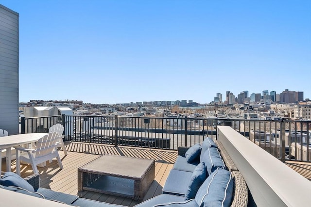 deck with an outdoor hangout area and a view of city