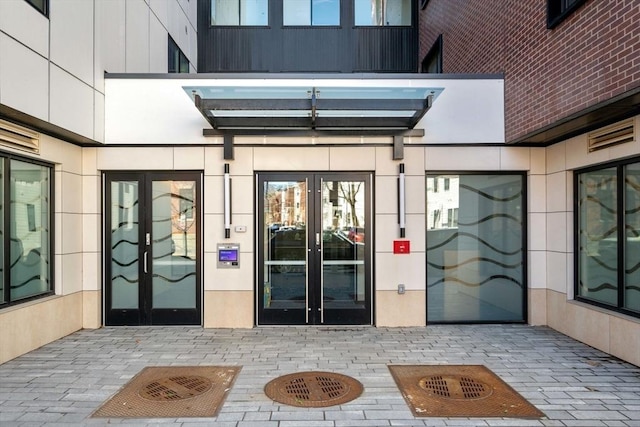 property entrance with french doors and a patio area