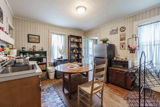 58 Field St, West Springfield, MA 01089 - kitchen featuring ornamental molding, freestanding refrigerator, and wood-type flooring