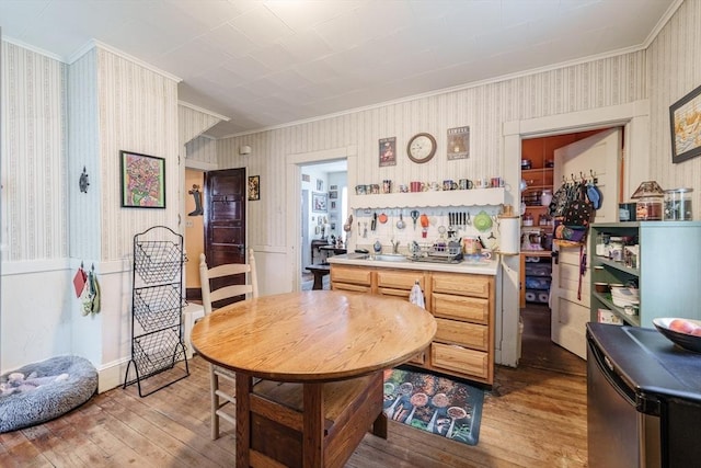 58 Field St, West Springfield, MA 01089 - dining area featuring crown molding, wood-type flooring, and wallpapered walls