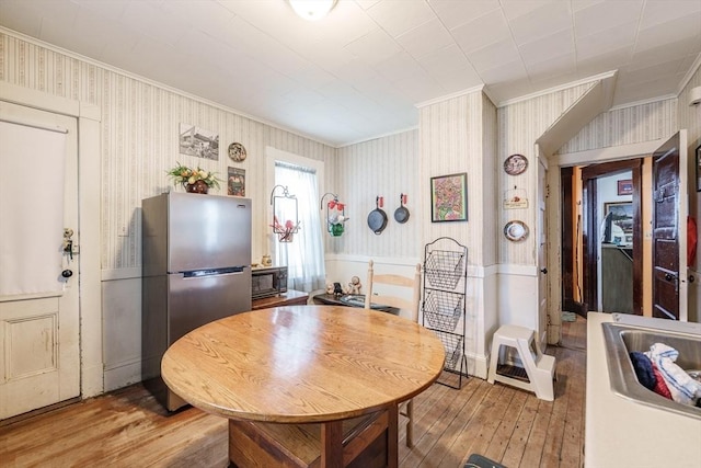 58 Field St, West Springfield, MA 01089 - dining space featuring ornamental molding, hardwood / wood-style flooring, and wallpapered walls