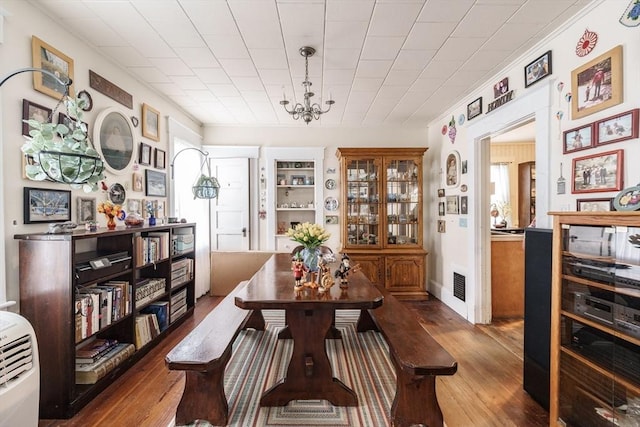 58 Field St, West Springfield, MA 01089 - dining room with wood finished floors and a chandelier