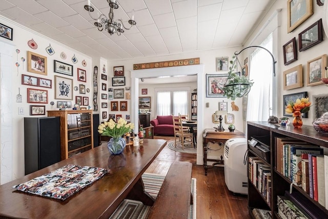 58 Field St, West Springfield, MA 01089 - dining space with dark wood-type flooring, a chandelier, and crown molding