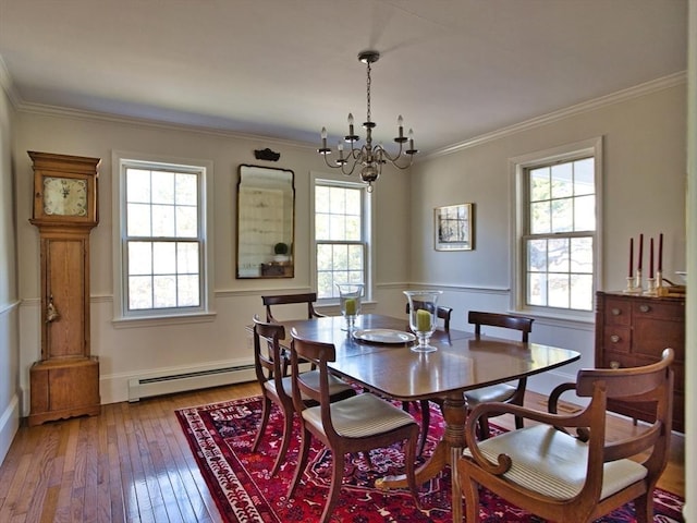 dining room with light wood-style floors, a baseboard radiator, a notable chandelier, and ornamental molding