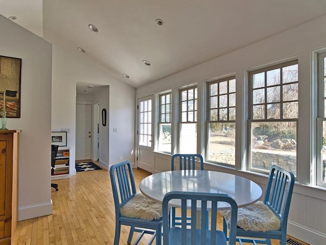 dining area with light wood-type flooring, vaulted ceiling, baseboards, and recessed lighting