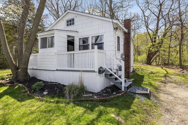 9 Nonantum Rd, Marblehead, MA 01945 - view of front of property featuring a chimney and a front yard