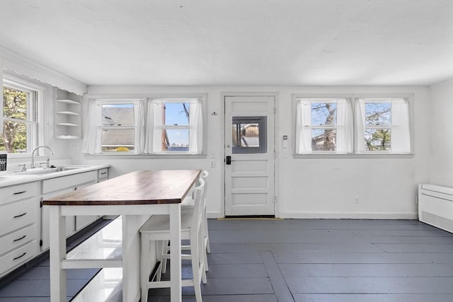 9 Nonantum Rd, Marblehead, MA 01945 - kitchen featuring a sink, plenty of natural light, butcher block countertops, and white cabinetry