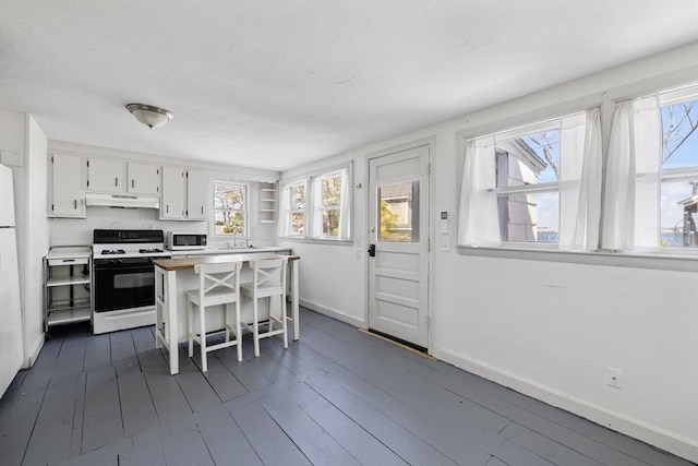 9 Nonantum Rd, Marblehead, MA 01945 - kitchen featuring white appliances, under cabinet range hood, open shelves, white cabinets, and baseboards