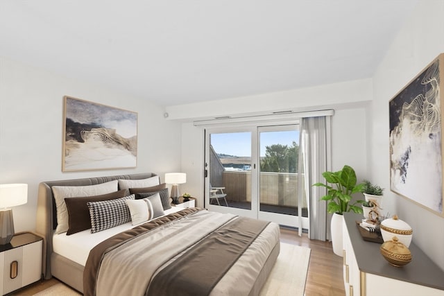 bedroom featuring access to outside and light wood-type flooring