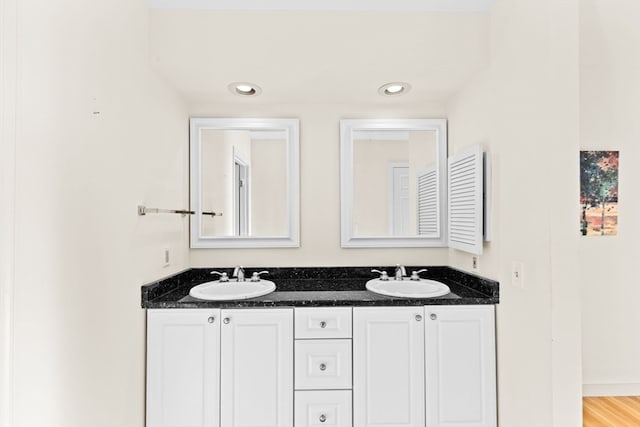 bathroom featuring hardwood / wood-style floors and vanity