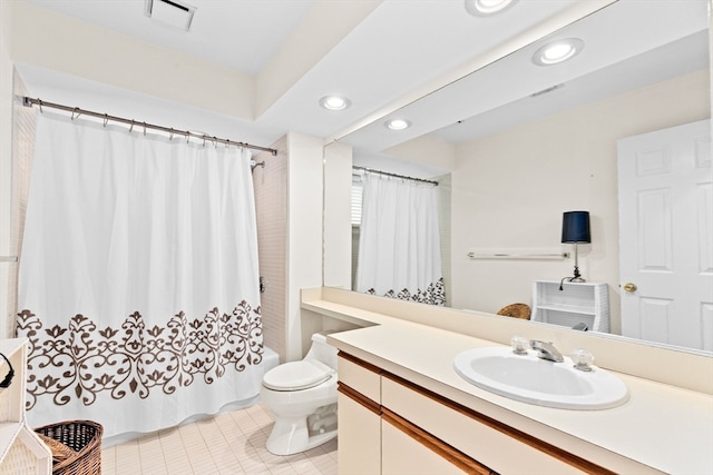 full bathroom featuring toilet, shower / tub combo with curtain, vanity, and tile patterned floors