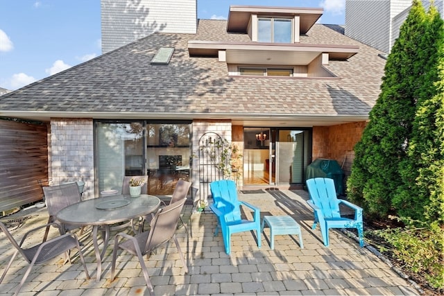 back of house with a patio area