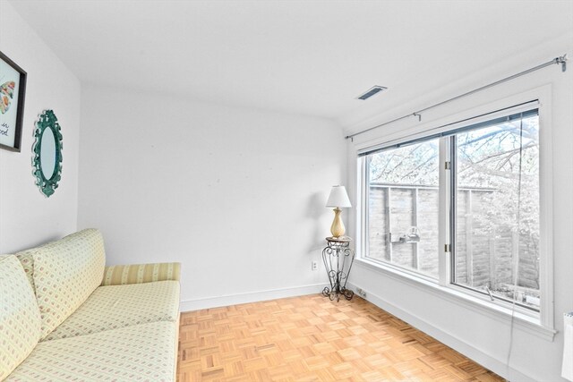 sitting room with light parquet flooring