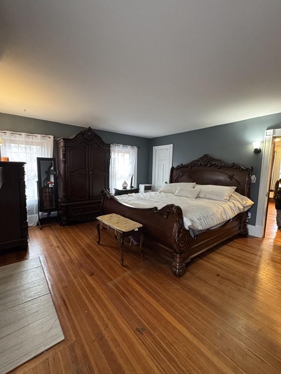 bedroom with hardwood / wood-style floors