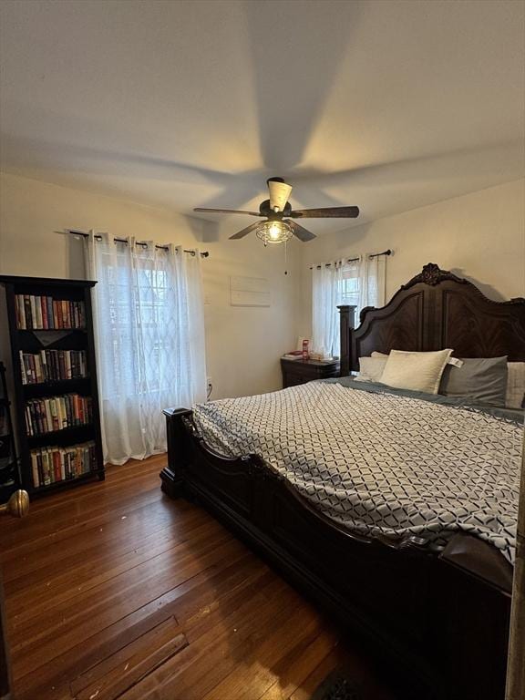 bedroom featuring ceiling fan and dark hardwood / wood-style floors