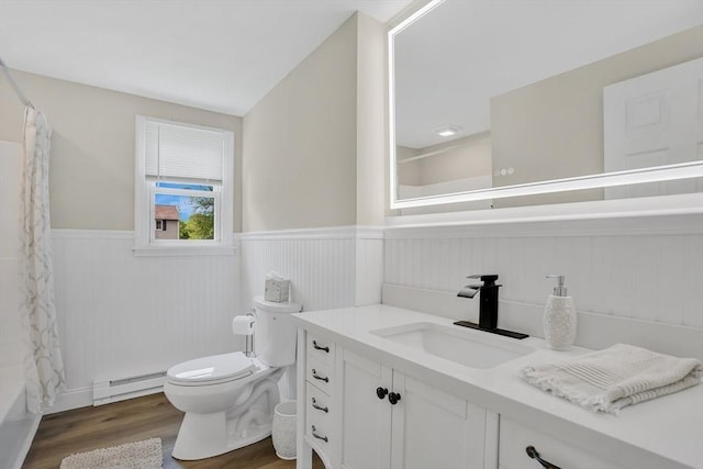 216 Pineview Cir, Agawam, MA 01001 - bathroom featuring a baseboard radiator, wainscoting, vanity, toilet, and wood finished floors