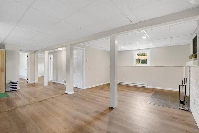 216 Pineview Cir, Agawam, MA 01001 - below grade area with a paneled ceiling, a baseboard heating unit, light wood-style floors, recessed lighting, and baseboards
