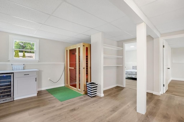 216 Pineview Cir, Agawam, MA 01001 - indoor dry bar featuring wine cooler, light wood finished floors, baseboards, and a paneled ceiling